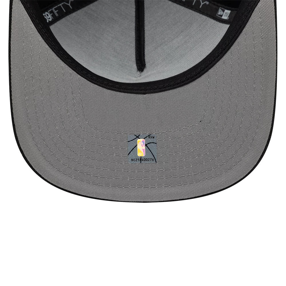 Boston Celtics NBA Bead Black New Era 59FIFTY A-Frame Fitted Cap, inside view showing a grey undervisor with an NBA logo sticker, surrounded by black sweatband and taping along the interior edge of the visor.