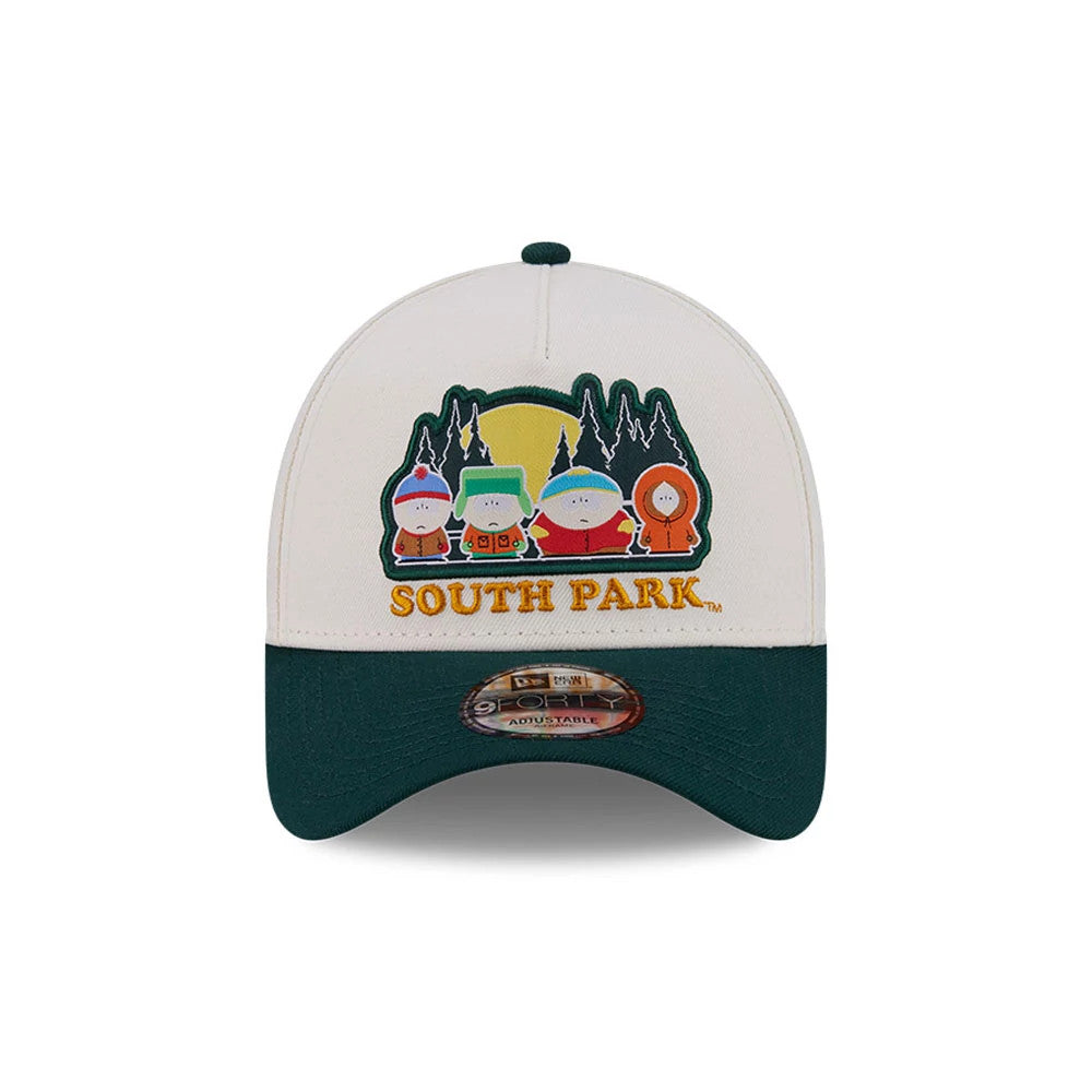 South Park White New Era 9FORTY A-Frame Adjustable Cap, front view showing a embroidered graphic of South Park characters on the front panel, a contrasting dark green visor with a 9FORTY size sticker, and a matching top button.