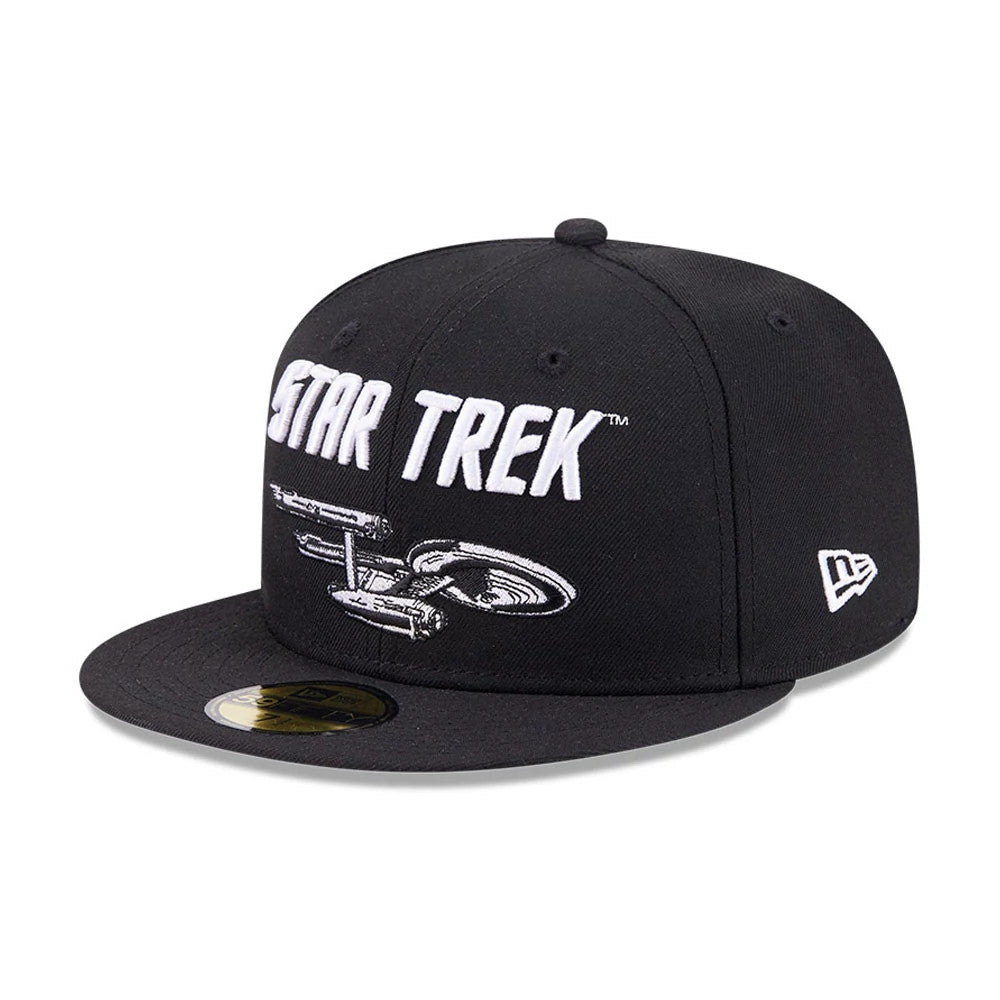 Star Trek Enterprise Black New Era 59FIFTY Fitted Cap, front view showing raised white Star Trek lettering and an embroidered starship graphic on the front panel, with a flat black visor and a gold 59FIFTY size sticker.