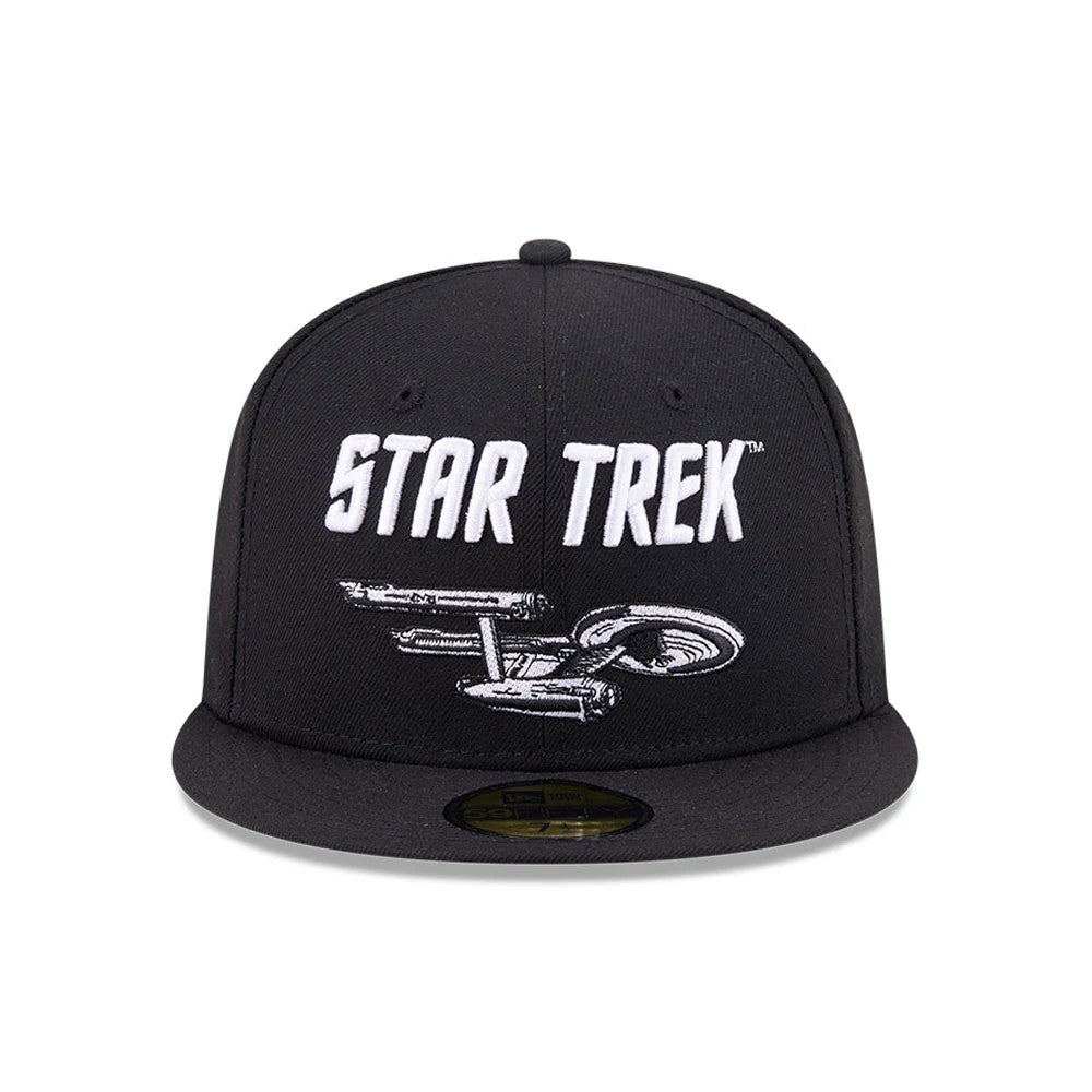 Star Trek Enterprise Black New Era 59FIFTY Fitted Cap, front view showing a white embroidered Star Trek logo above the detailed silver depiction of the USS Enterprise on the black structured crown, with a gold 59FIFTY size sticker on the flat visor.