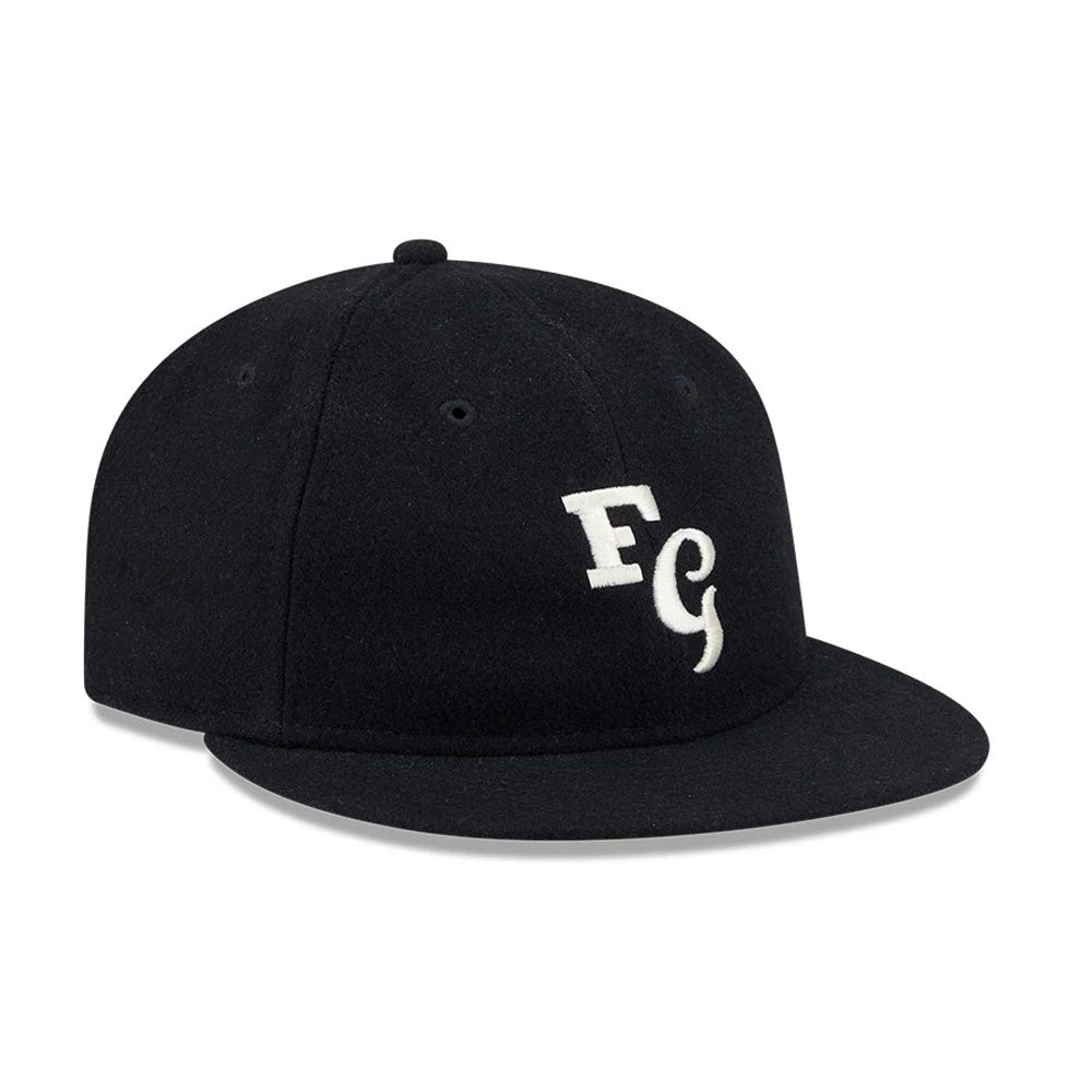 Chicago White Sox Fear Of God X MLB Black Retro Crown New Era 59FIFTY Fitted Cap, three-quarter view showing the white FG logo in raised embroidery on the front panel, with a flat black visor and a black top button.