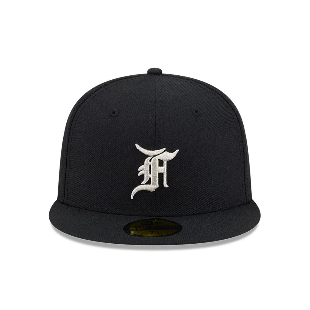 Chicago White Sox Fear Of God X MLB Black New Era 59FIFTY Fitted Cap, front view showing a raised white embroidered logo on the structured black crown, complemented by a flat black visor and a gold 59FIFTY size sticker on the visor.