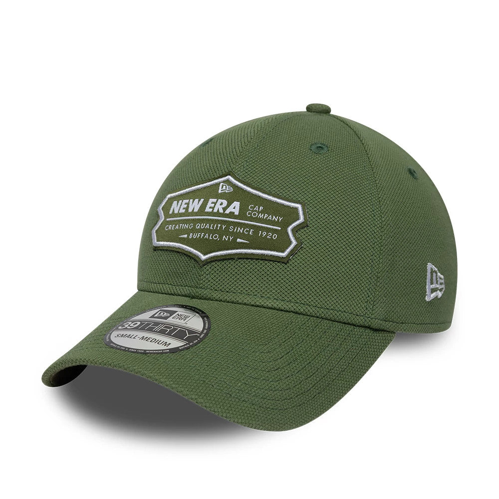 New Era Jersey Green New Era 39THIRTY Stretch Fit Cap, three-quarter view showing a white raised embroidered crest logo with New Era Cap Company on the front panel, curved green visor with a 39THIRTY size sticker.