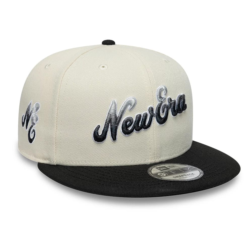 Pictured is this New Era Ombre Script 9FIFTY Snapback cap in light beige & black. 1
