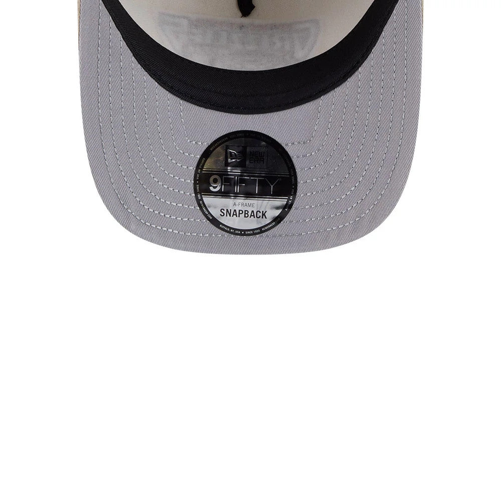 Vancouver Grizzlies NBA Light Beige New Era 9FIFTY A-Frame Snapback Adjustable Cap, underside view showing light grey underside with stitching, black sweatband along the edge, and 9FIFTY size sticker at the centre of the flat visor.