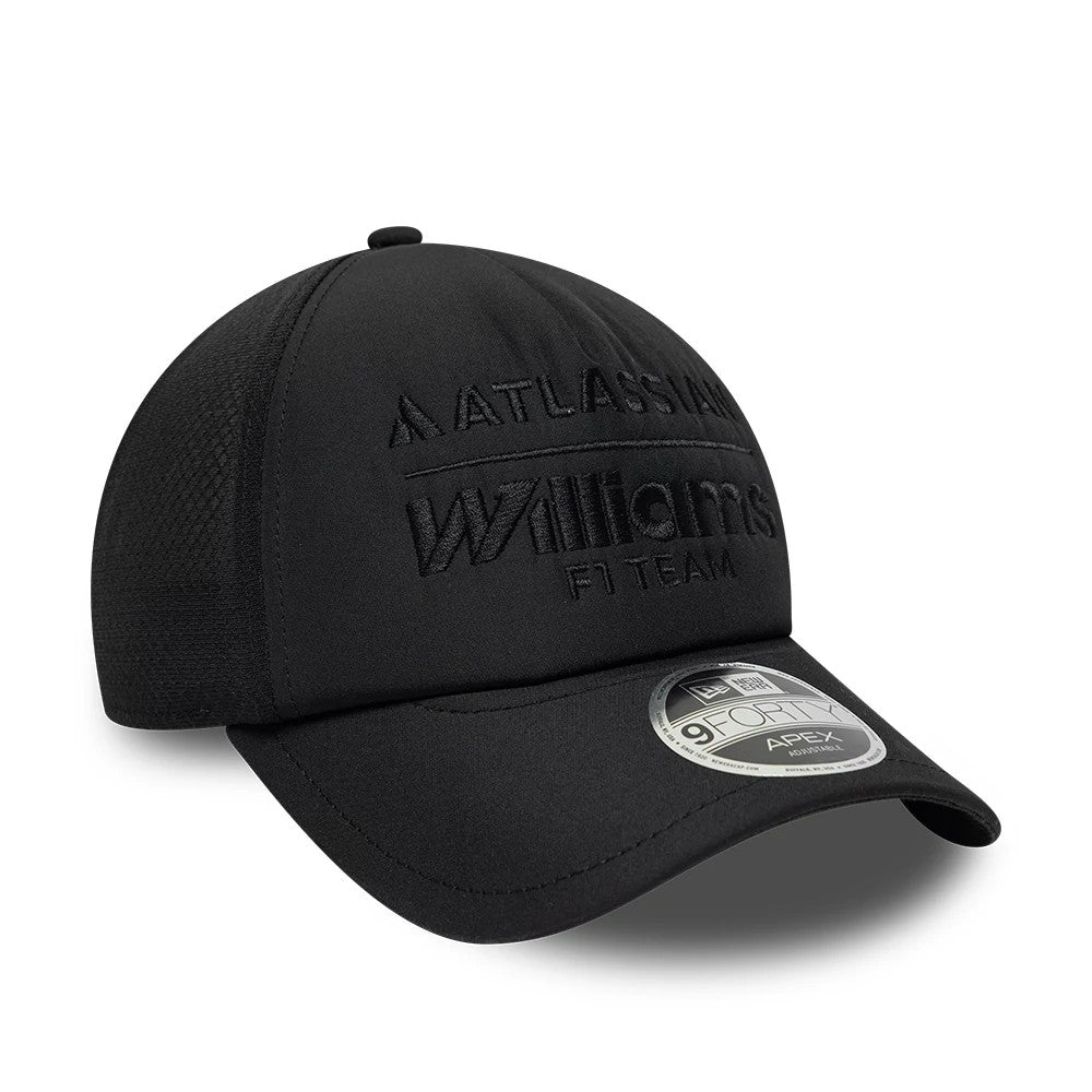 Williams Black New Era 9FORTY Apex Adjustable Cap, three-quarter view showing raised black embroidery of the Atlassian and Williams F1 Team logos on the structured black crown, black curved visor with a 9FORTY size sticker.