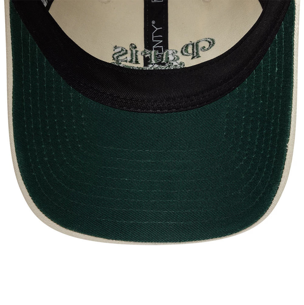 Paris Saint-Germain Womens Script Light Beige New Era 9TWENTY Adjustable Cap, inside view showing a dark green undervisor with embroidered Paris script, black sweatband, and black taping featuring the New Era logo, against a light beige interior.