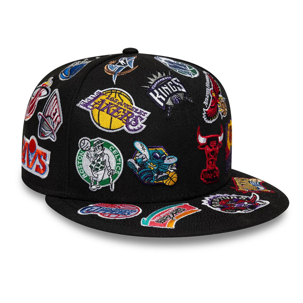 NBA All Over Hardwood Classic All Over Black New Era 59FIFTY Fitted Cap, three-quarter view showing multiple team logos intricately embroidered across the black structured panels and visor, with the Chicago Bulls.