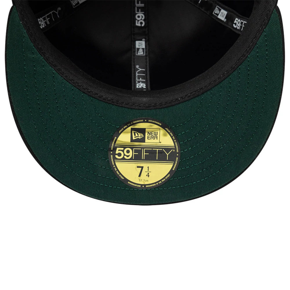 NBA All Over Hardwood Classic All Over Black New Era 59FIFTY Fitted Cap, inside view showing the black and green undervisor with a gold 59FIFTY size sticker, black interior taping featuring repeating 59FIFTY and New Era logos.