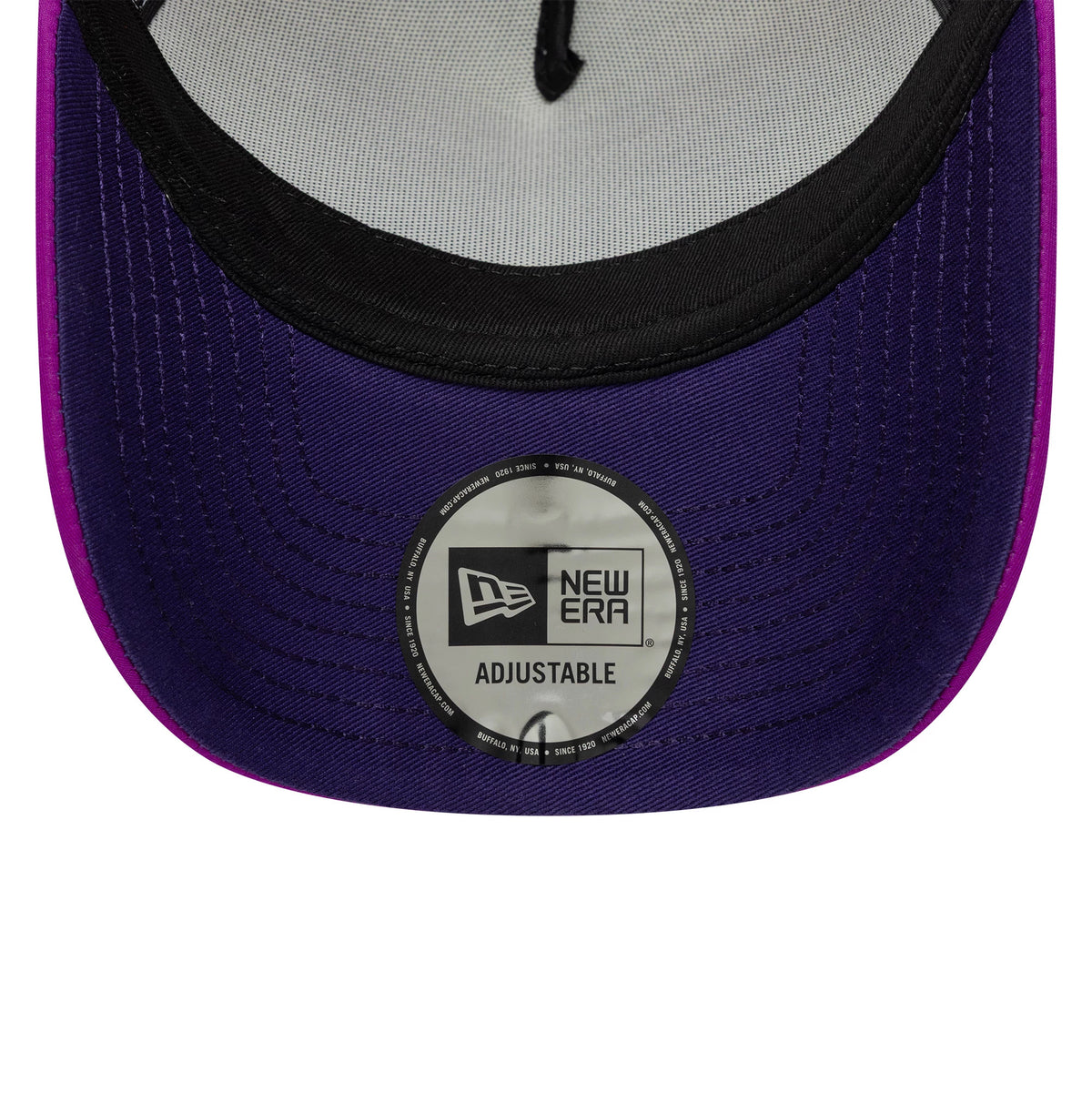 Red Bull Racing Vegas Race Special Isack Hadjar White New Era 9FORTY A-Frame Trucker Adjustable Cap, inside view showing the black sweatband, white mesh lining, and purple undervisor with a New Era adjustable sticker centrally placed.