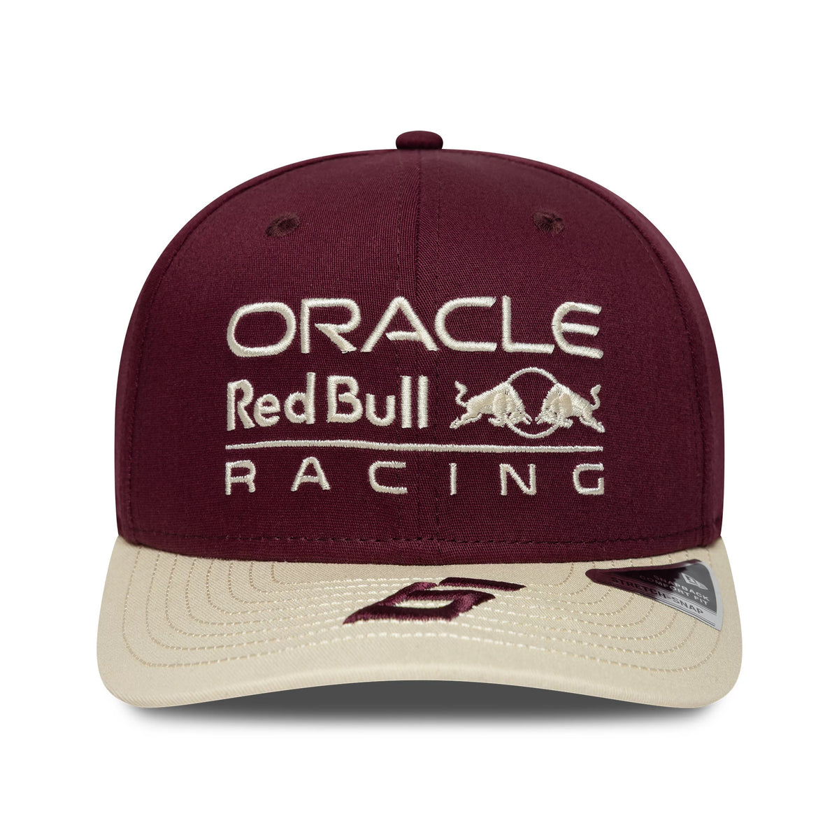 Red Bull Racing Austin Race Special Isack Hadjar Burgundy New Era 9SEVENTY Stretch Snap Cap, front view showing white embroidered Oracle Red Bull Racing logo on the burgundy crown, contrasted with a beige curved visor.