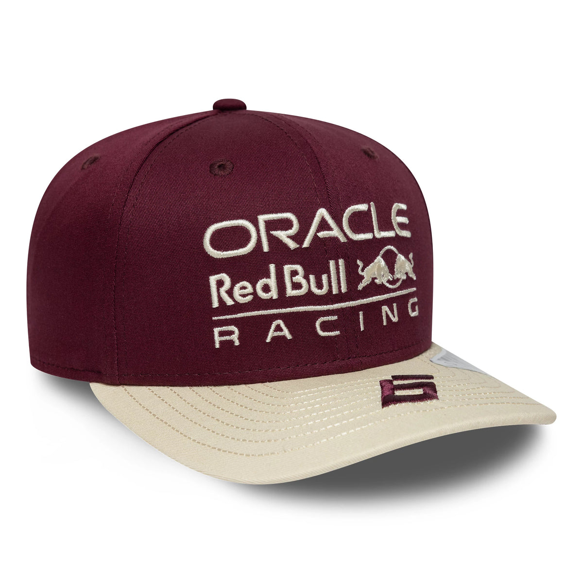 Red Bull Racing Austin Race Special Isack Hadjar Burgundy New Era 9SEVENTY Stretch Snap Cap, three-quarter view showing the white raised embroidered front logo on the structured burgundy crown, cream curved visor and a 9SEVENTY size sticker.
