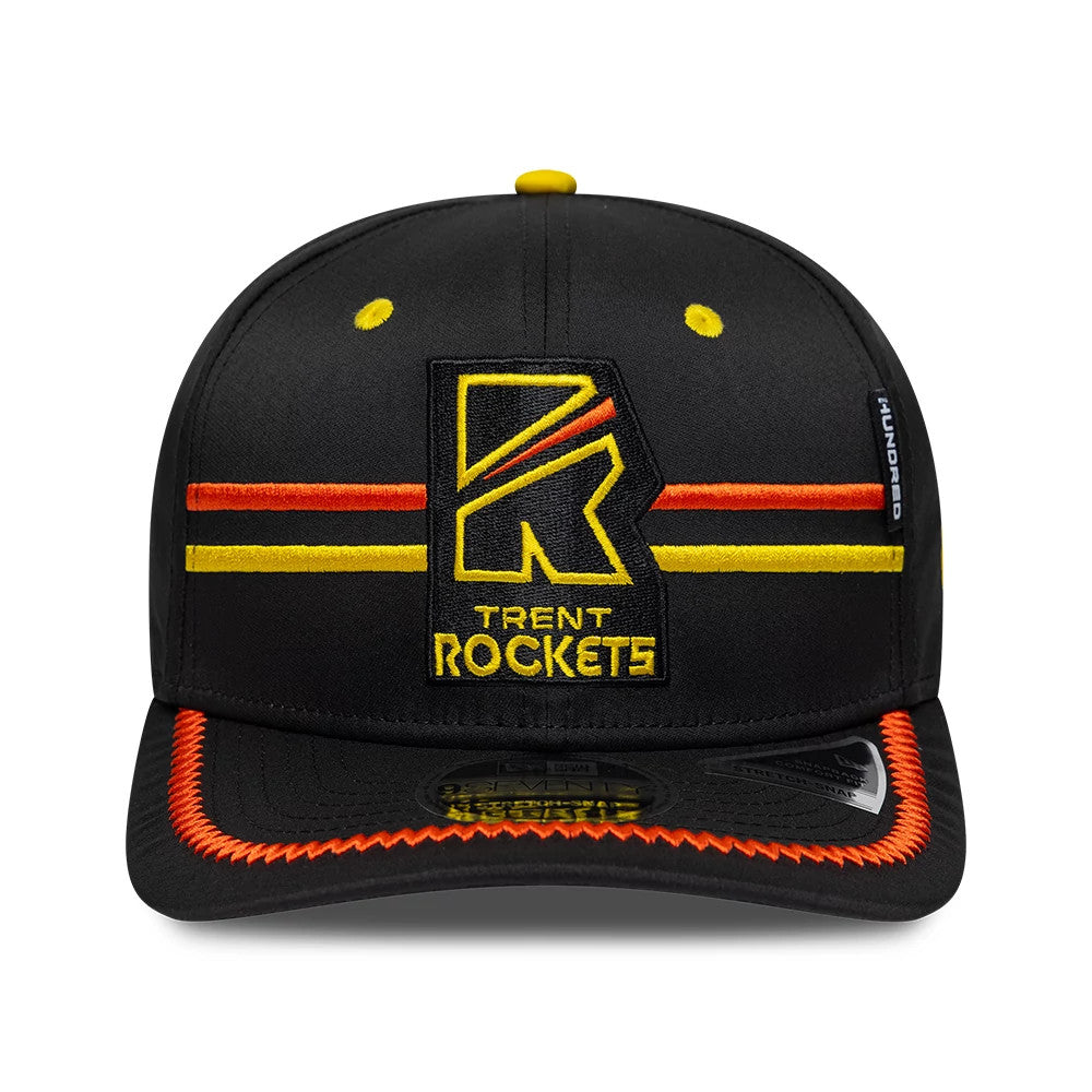 Trent Rockets The Hundred 2026 Black New Era 9SEVENTY Stretch Snap Adjustable Cap, front view showing the embroidered yellow and orange Trent Rockets logo, black visor with orange stitching, and a 9SEVENTY size sticker on the visor.