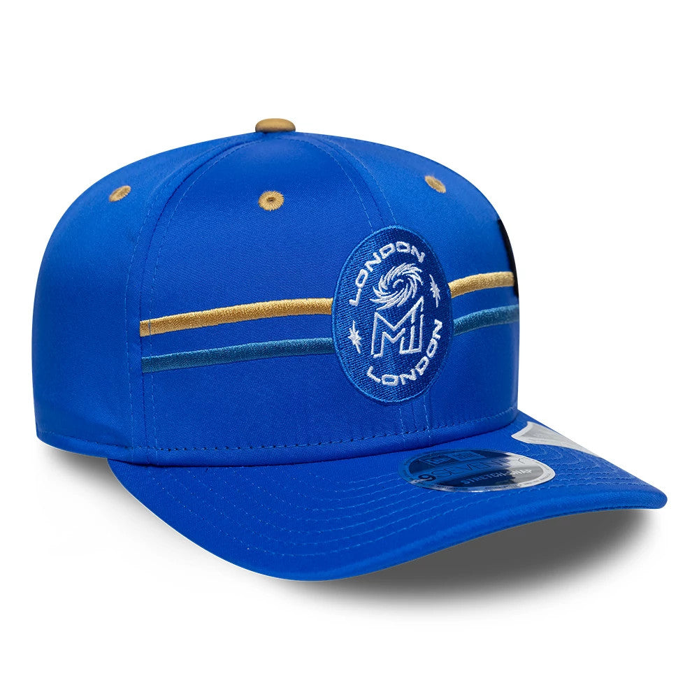 MI London The Hundred 2026 Bright Blue New Era 9SEVENTY Stretch Snap Adjustable Cap, three-quarter view showing a raised blue and white MI London logo on the front panel, embroidered gold and blue horizontal stripes.
