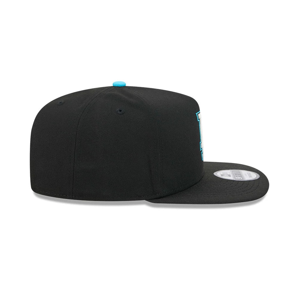 LA Dodgers MLB Electrocute Black New Era 9FIFTY A-Frame Snapback Adjustable Cap, side view showing the blue New Era flag logo on the left side, flat black visor, and sky blue top button, with a 9FIFTY size sticker on the visor.
