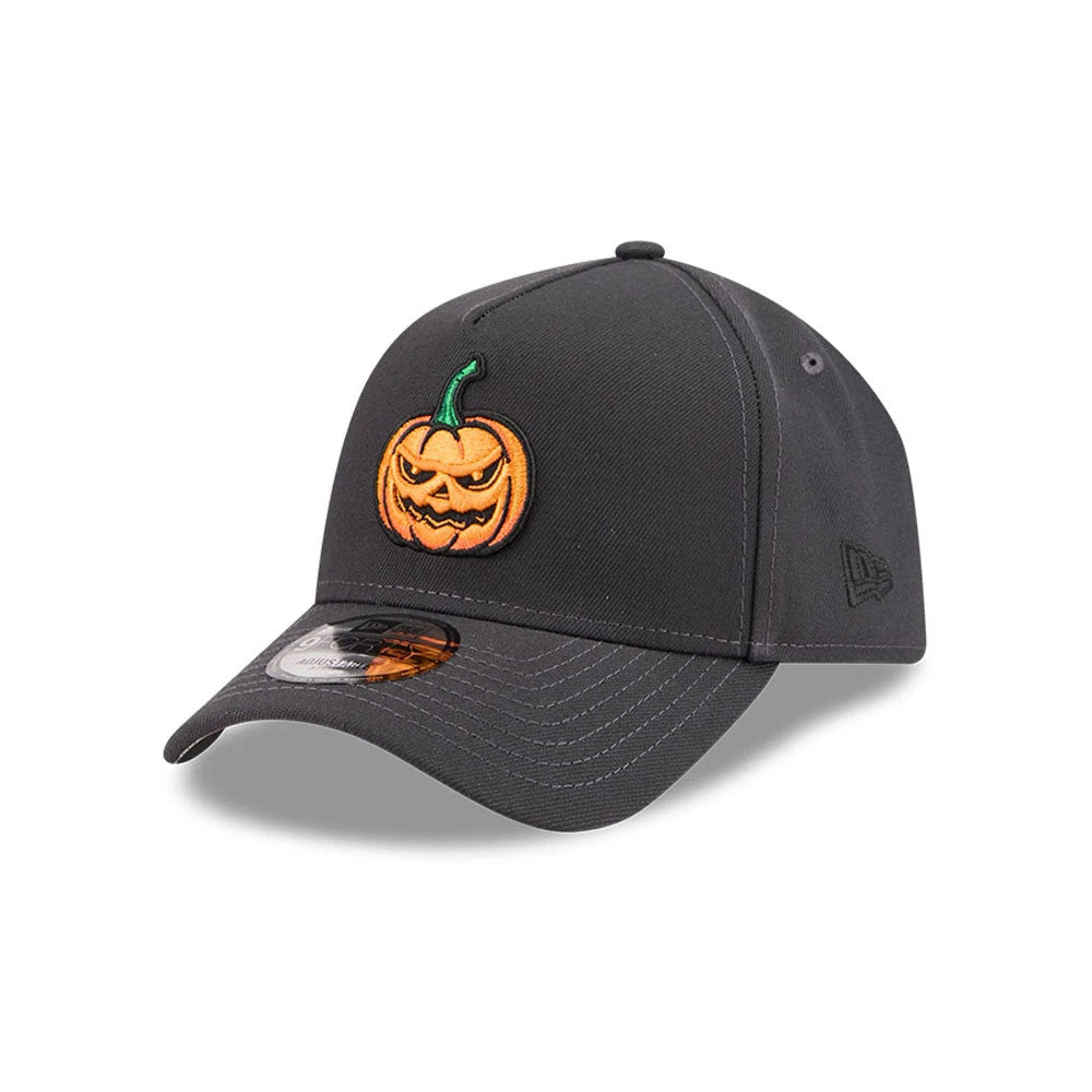 New Era Jack O Lantern Black 9FORTY A-Frame Adjustable Cap, three-quarter view showing an orange and green raised embroidered pumpkin on the front panel, a curved black visor with a 9FORTY size sticker, and a New Era flag logo on the left side.