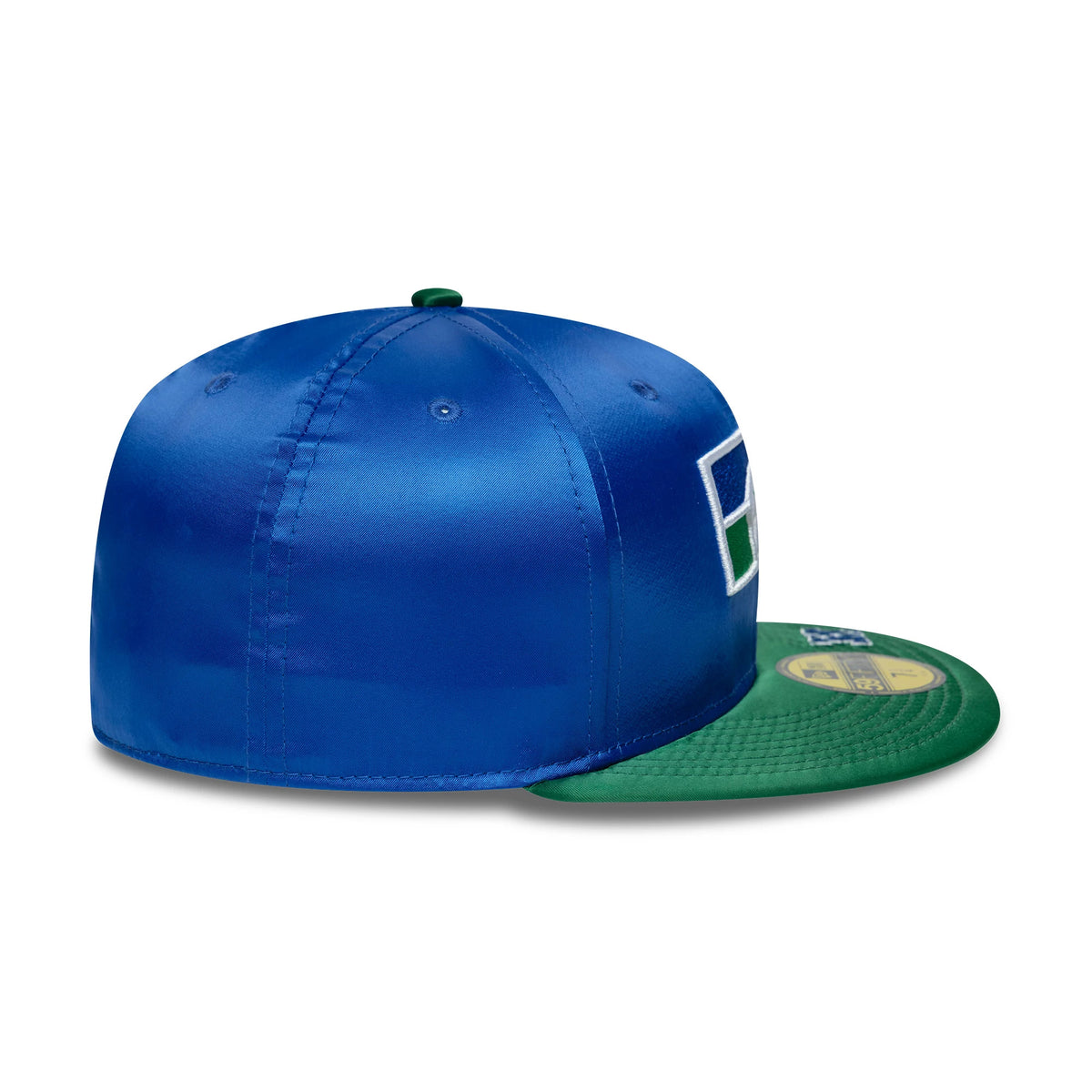 Seattle Seahawks NFL Satin Blue & Green New Era 59FIFTY Fitted Cap, side view showing the embroidered team logo on the blue satin crown, with a contrast green flat visor and a gold 59FIFTY size sticker on top.