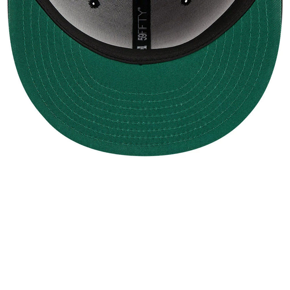New Era Praying Skeleton Black 59FIFTY Fitted Cap, inside view showing a green undervisor, black sweatband, and grey crown lining with the 59FIFTY taping running along the seam at the centre.