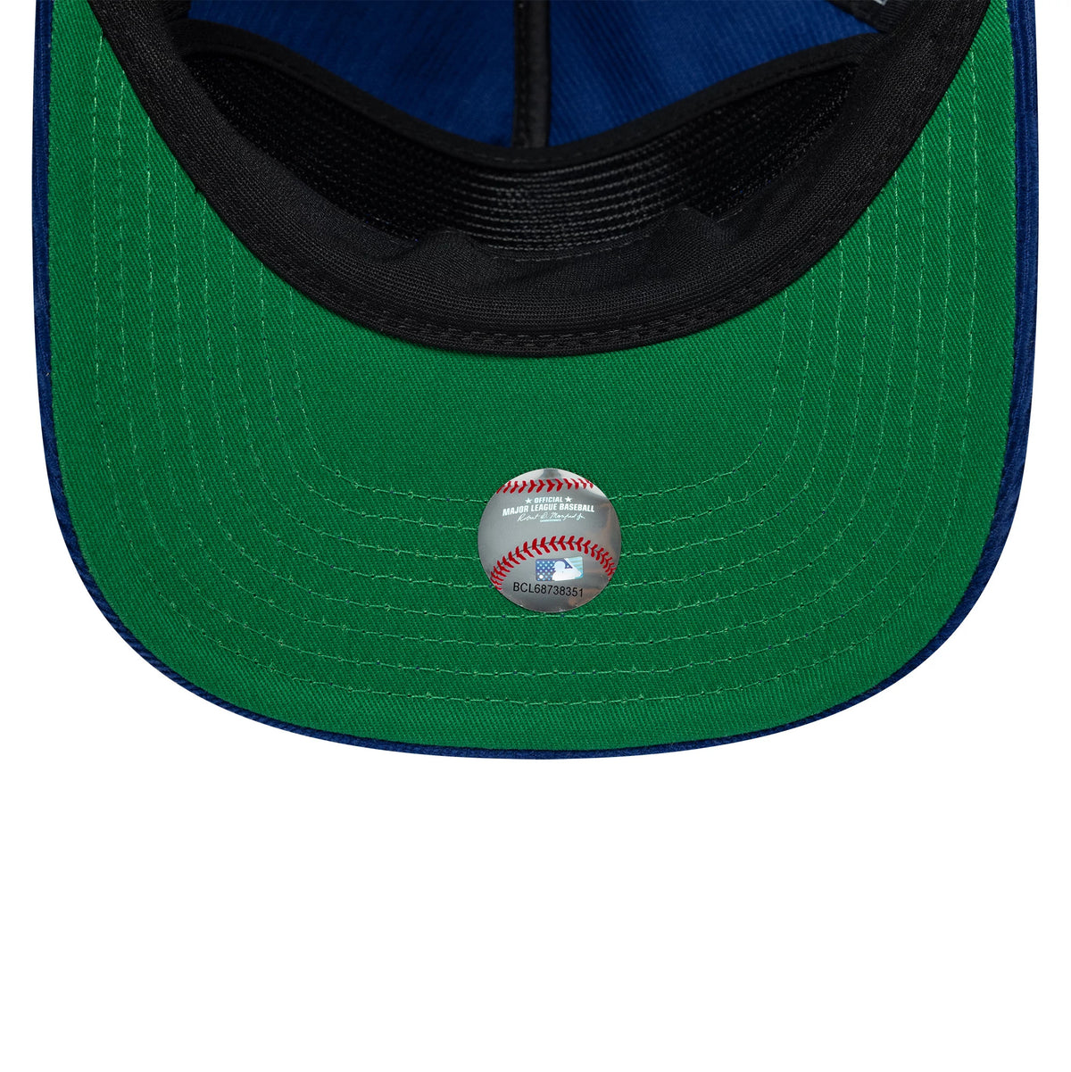 LA Dodgers MLB Retro Dynasty Cord Dark Blue New Era 19TWENTY Adjustable Cap, inside view showing a vivid green undervisor with a round sticker depicting a baseball, a black sweatband, and blue interior panel fabric.