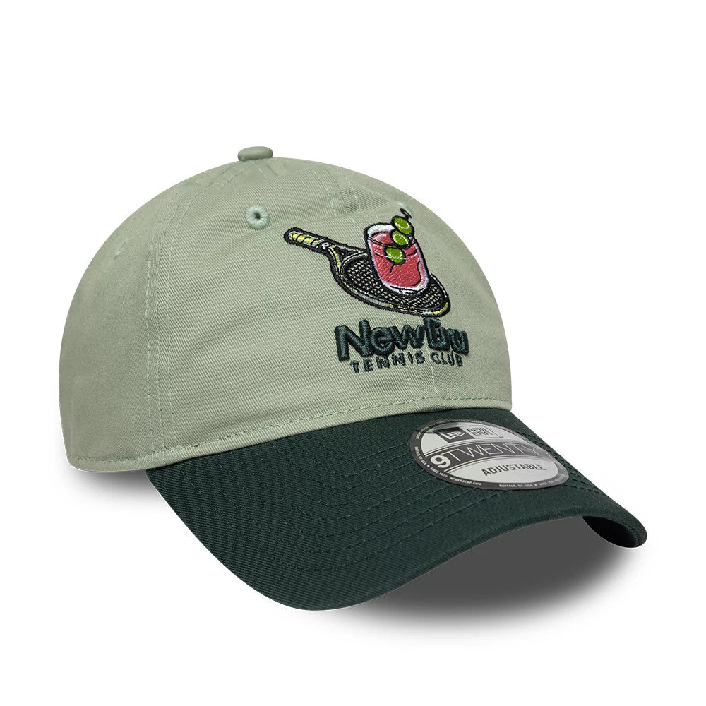 New Era Tennis Club Pastel Green 9TWENTY Adjustable Cap, front view showing an embroidered tennis racquet and drink design on the light green front panel, a contrasting dark green curved visor, and a 9TWENTY size sticker on the visor.