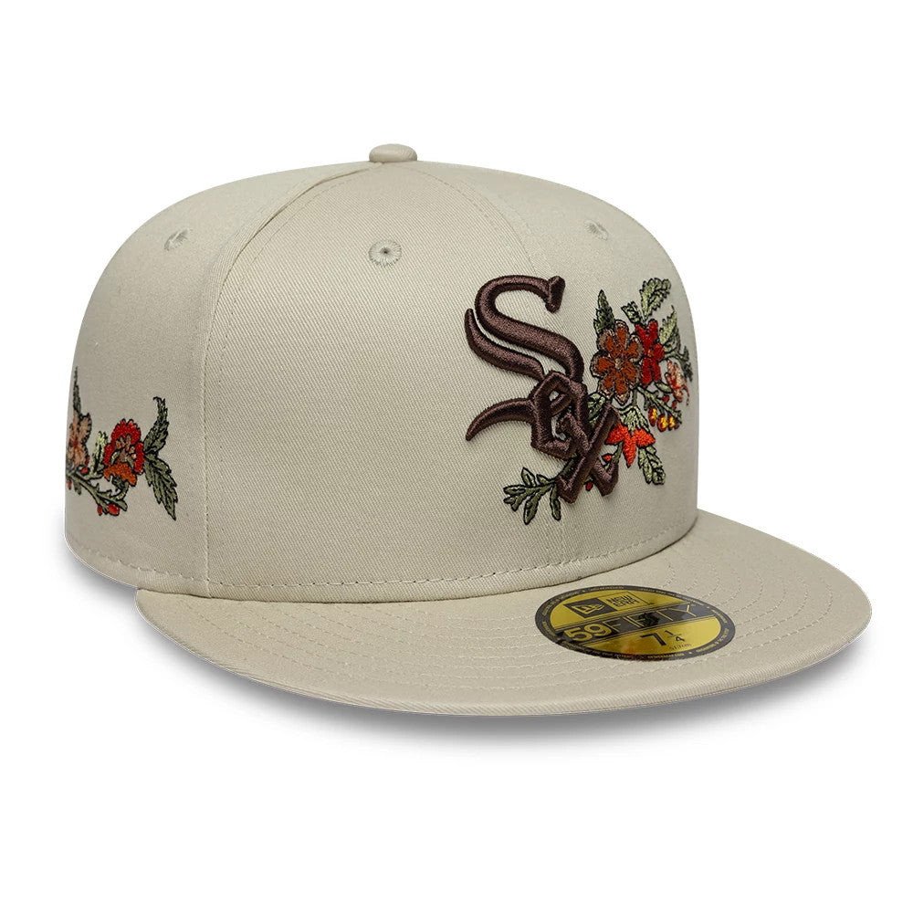 Chicago White Sox MLB Floral Light Beige New Era 59FIFTY Fitted Cap, three-quarter view showing brown and red embroidered floral designs alongside the brown team logo on the front panels, with a matching flat visor and a gold 59FIFTY size sticker.
