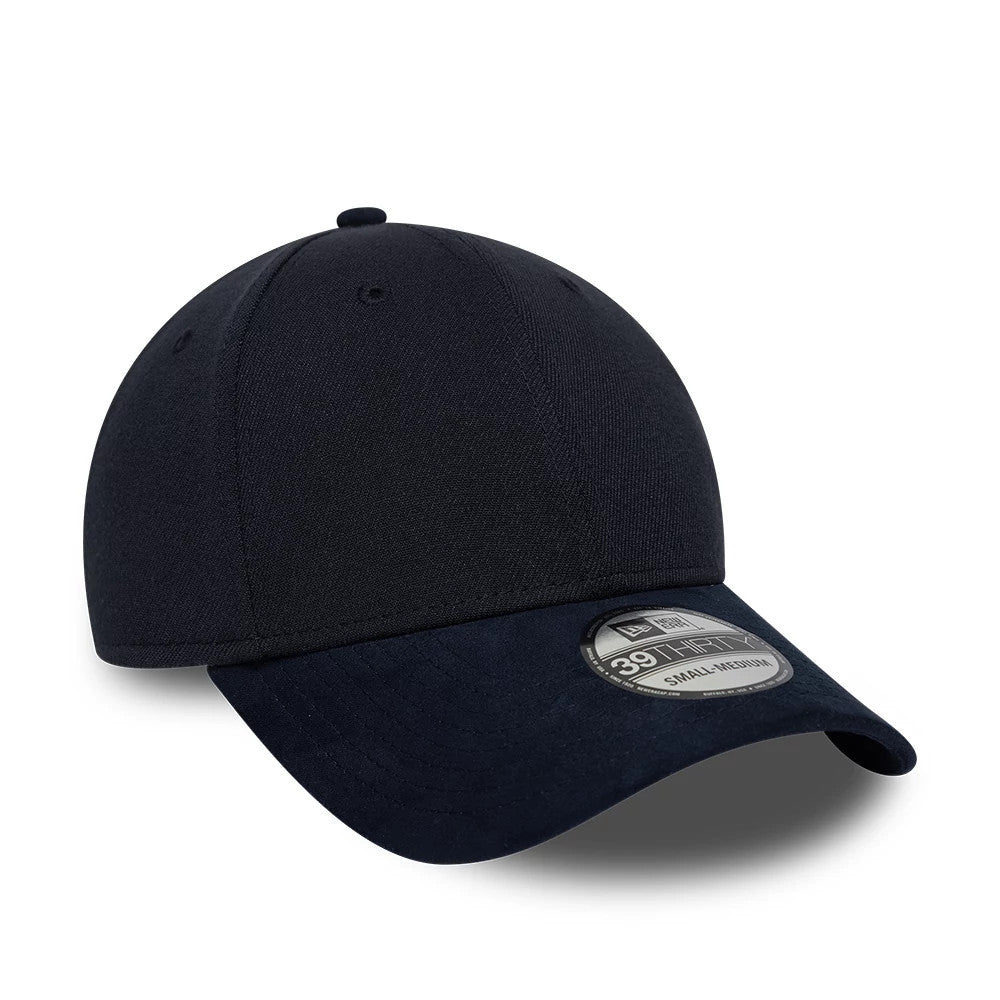 New Era Suede Visor Navy 39THIRTY Stretch Fit Cap, three-quarter view showing the navy suede visor with a curved shape, the black 39THIRTY size sticker on the top, and the structured crown with embroidered eyelets.