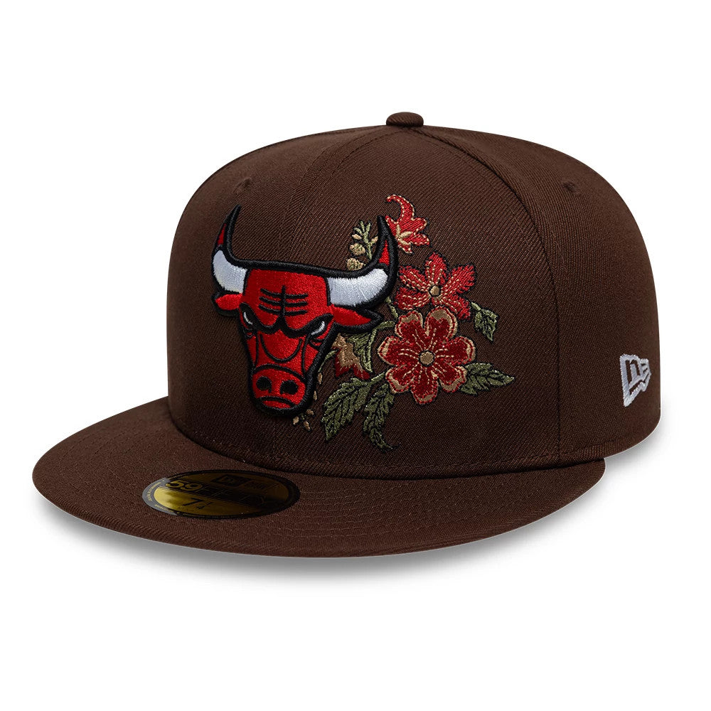 Chicago Bulls NBA Floral Dark Brown New Era 59FIFTY Fitted Cap, three-quarter view showing the red and white embroidered Bulls logo with floral on the front panel, complemented by a flat brown visor and a gold 59FIFTY size sticker.
