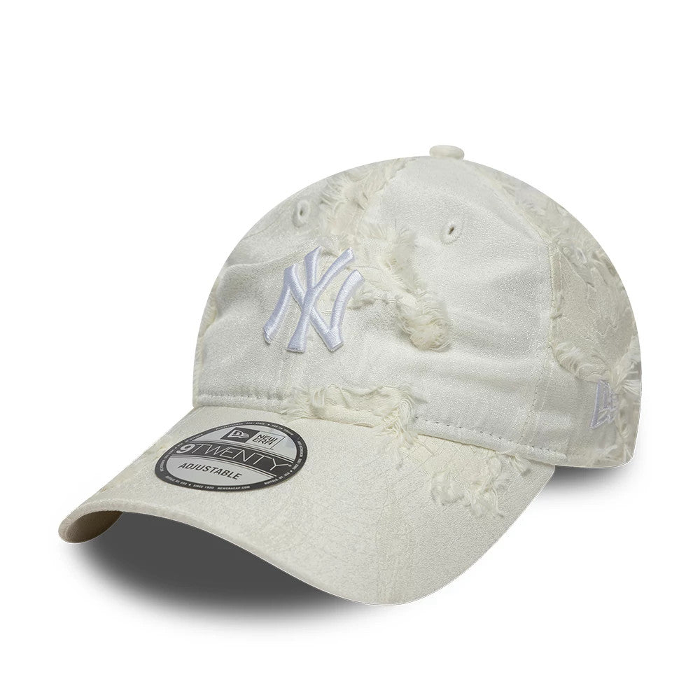 New York Yankees MLB Frayed Cream New Era 9TWENTY Adjustable Cap, front view showing a raised white embroidered NY logo on the frayed cream fabric, with a curved visor and 9TWENTY size sticker on top.