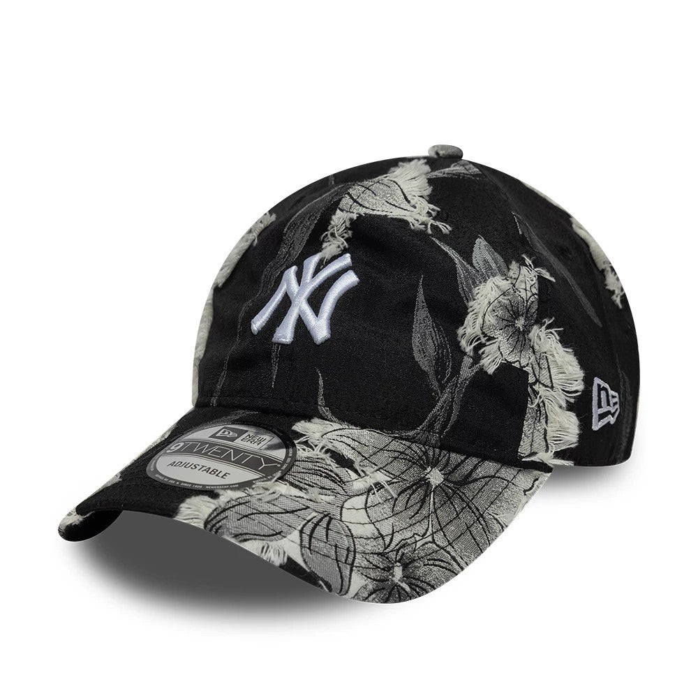 New York Yankees MLB Frayed Black New Era 9TWENTY Adjustable Cap, three-quarter view showing the white embroidered NY logo on the front panel, detailed with frayed floral patterns across the entire black crown and visor, and a 9TWENTY size sticker.