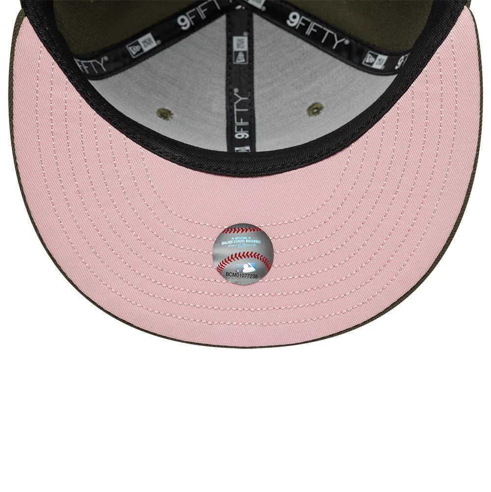 LA Dodgers MLB Floral Green New Era 9FIFTY Snapback Adjustable Cap, inside view showing a pink undervisor with a grey MLB sticker at the centre, black taping with white 9FIFTY branding, and a grey sweatband.