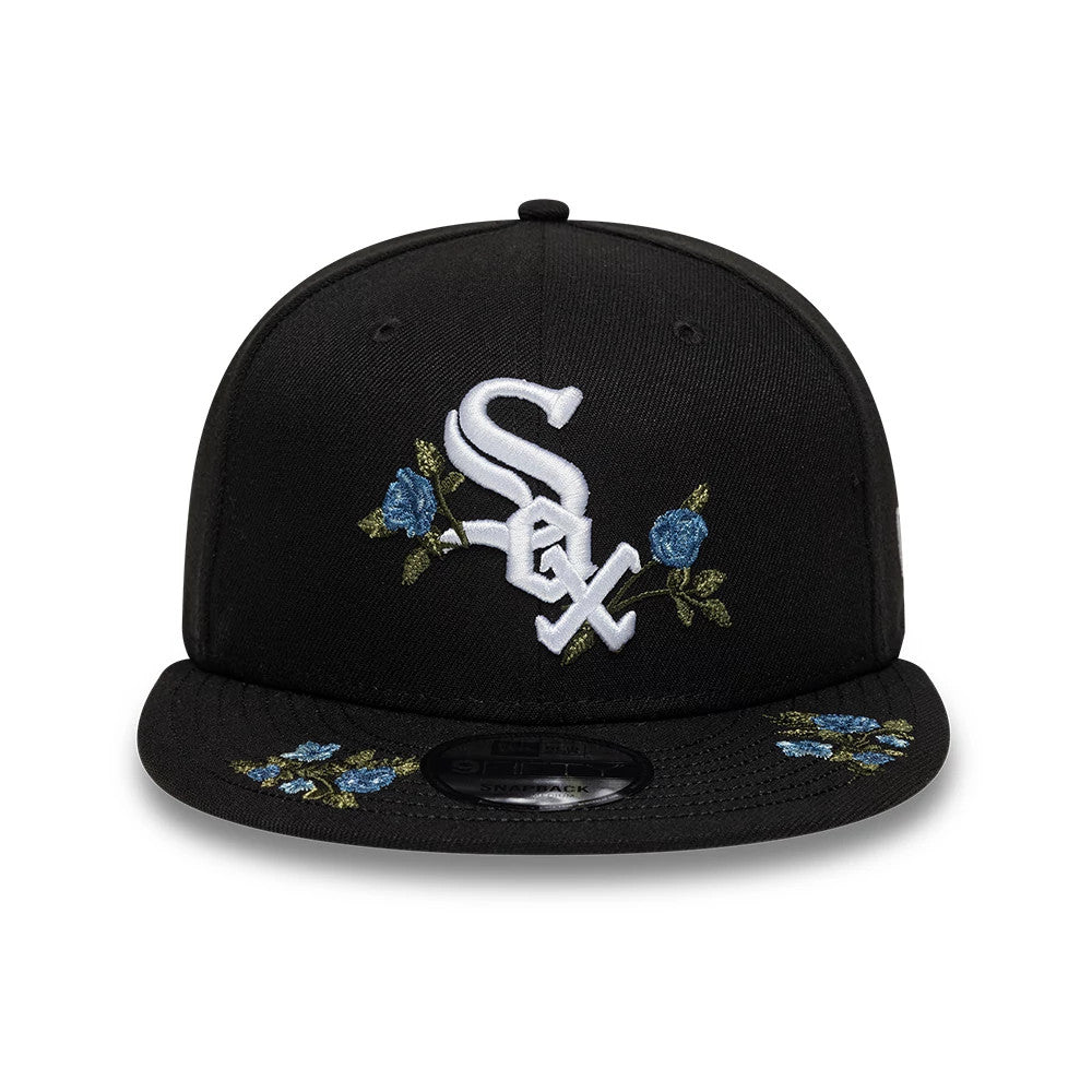 Chicago White Sox MLB Floral Black New Era 9FIFTY Snapback Adjustable Cap, front view showing the raised white Sox logo embroidered on the front panel, with blue floral embroidery on the visor and a 9FIFTY size sticker on the flat black visor.