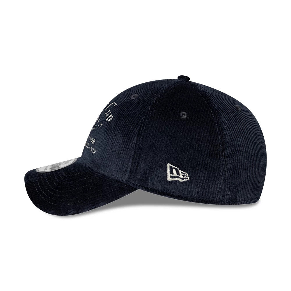 Ryder Cup 2027 Cord Navy New Era 39THIRTY Stretch Fit Cap, side view showing the white embroidered New Era flag logo on the left side, the structured navy corduroy crown with eyelets, and a curved visor with a 39THIRTY size sticker.