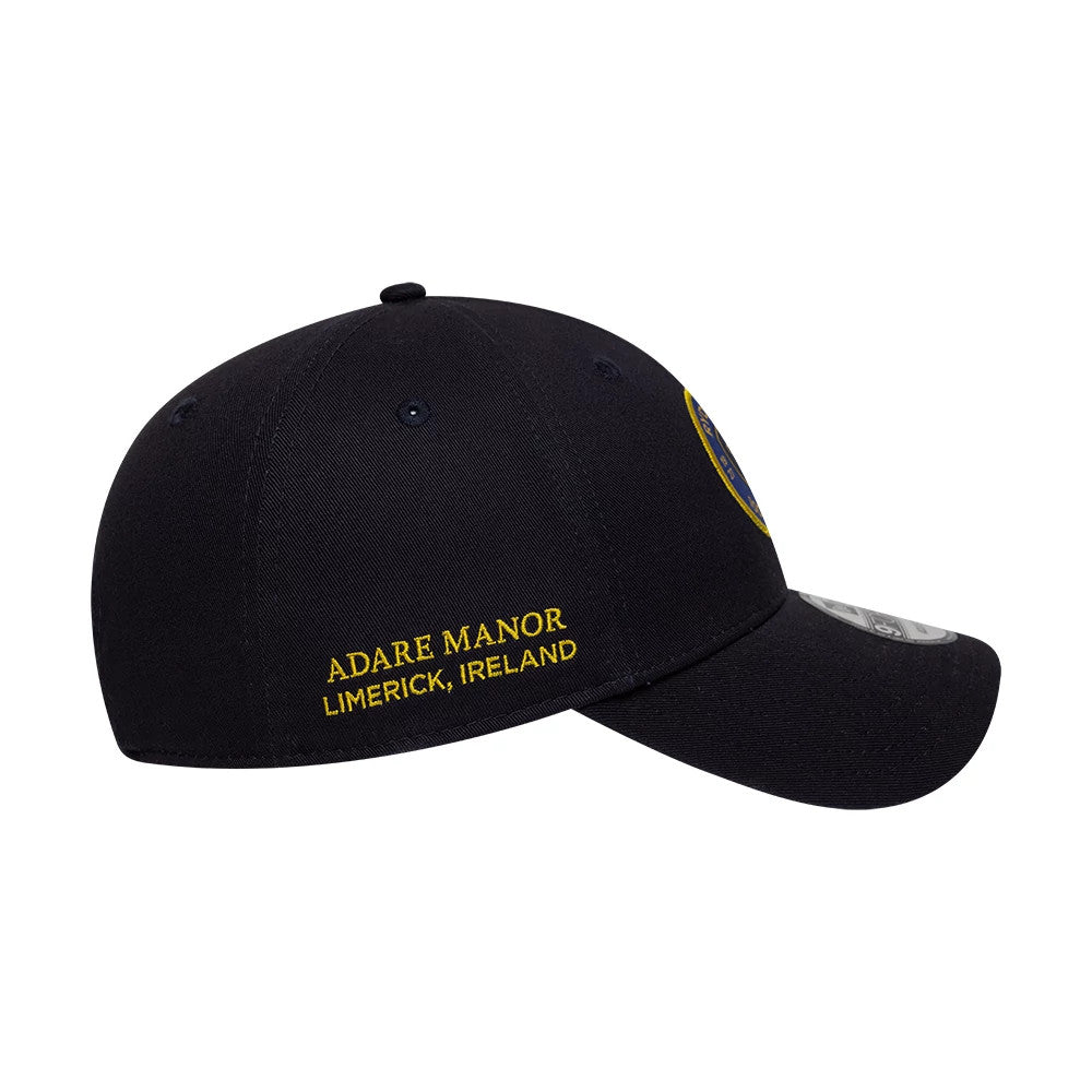 Ryder Cup 2027 100 Years Navy New Era 9FORTY Adjustable Cap, side view featuring yellow embroidered Adare Manor Limerick, Ireland text on the left panel, a curved black visor, and a 9FORTY size sticker on the top.
