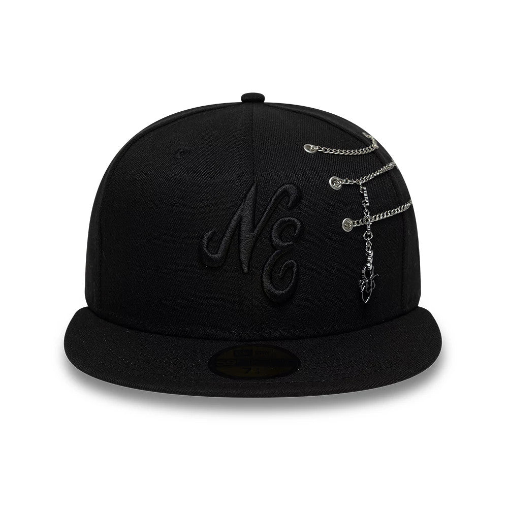 New Era Spider Pin Chain Black 59FIFTY Fitted Cap, front view showing the black embroidered NE logo on the front panel, with chain leading to a dangling spider charm, and a black flat visor featuring a gold 59FIFTY size sticker.