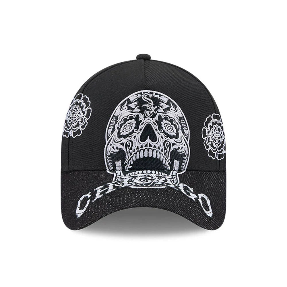 Chicago White Sox MLB Day Of The Dead Black New Era 9FORTY A-Frame Adjustable Cap, front view showing a large white sugar skull embroidery on the structured black crown, flanked by floral designs, with Chicago text on the black curved visor.