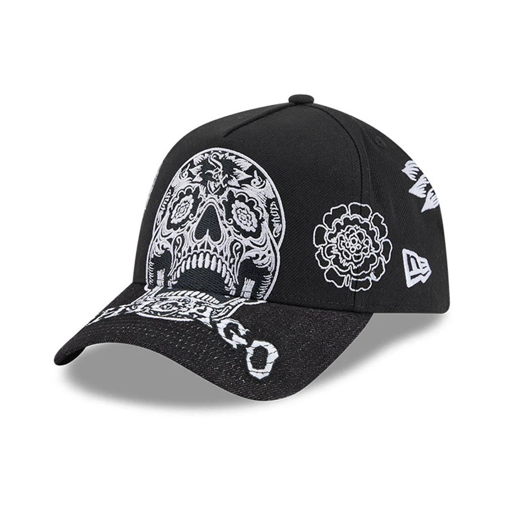 Chicago White Sox MLB Day Of The Dead Black New Era 9FORTY A-Frame Adjustable Cap, three-quarter view showing a white embroidered skull on the front panel, floral patterns on the side, and a New Era flag logo on the left side.