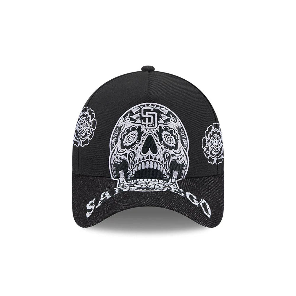 San Diego Padres MLB Day Of The Dead Black New Era 9FORTY A-Frame Adjustable Cap, front view showing a white embroidered sugar skull design on the structured black crown, San Diego text on the curved visor, with floral details on the side panels.
