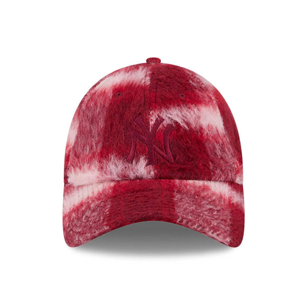 New Era New York Yankees MLB Fabric Story Red Casual Classic Adjustable Cap, front view showing the red raised embroidered New York Yankees logo on a unique red and white textured marbled fabric pattern covering the structured crown and curved visor.