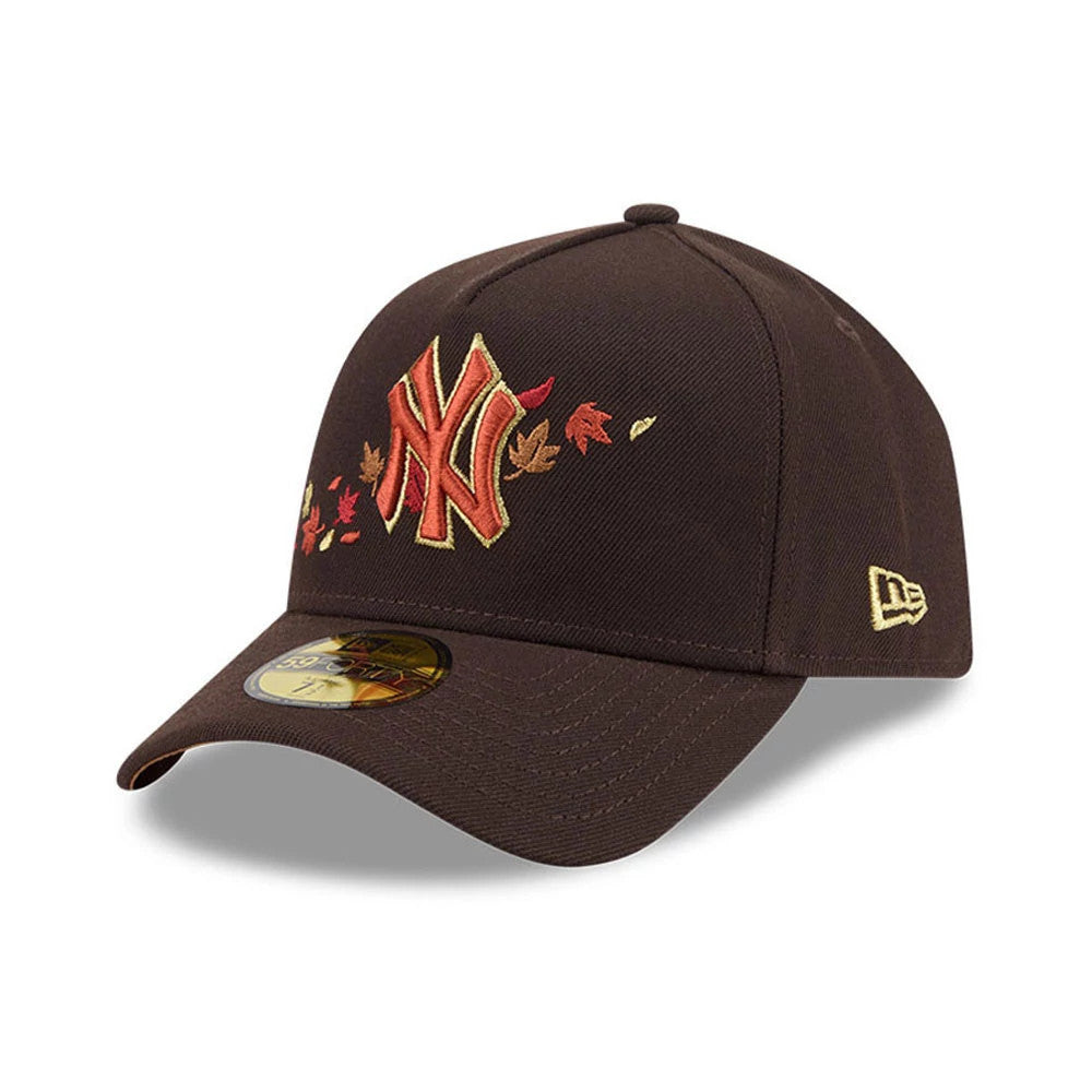 Yankees MLB Fall Story Dark Brown New Era 59FORTY A-Frame Fitted Cap, three-quarter view showing a red and gold embroidered Yankees logo with autumn leaves on the front panel, a curved visor with a 59FORTY size sticker.