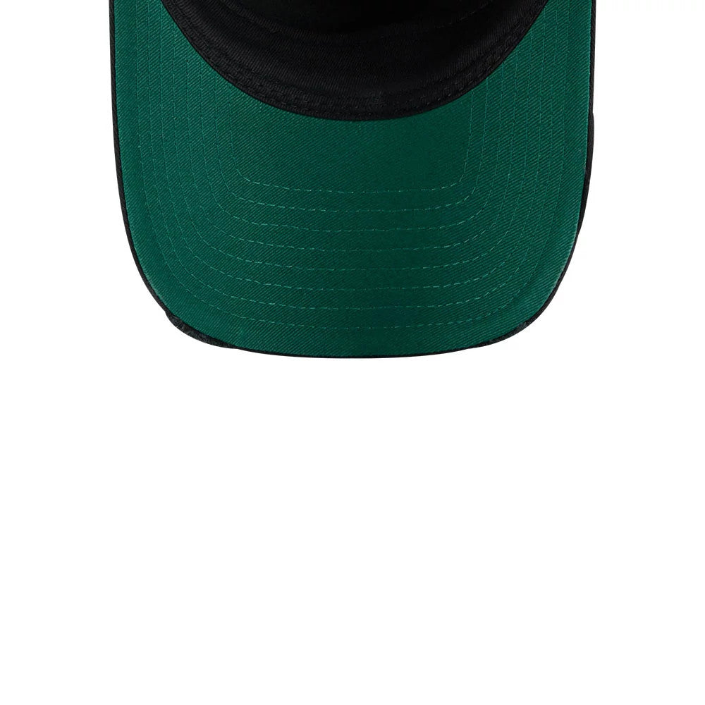 Harry Potter Deathly Hallows Black New Era 9FORTY A-Frame Unstructured Cap, close-up view showing the green undervisor with stitching lines, black visor edge, and the inside of the black cap's curved visor.