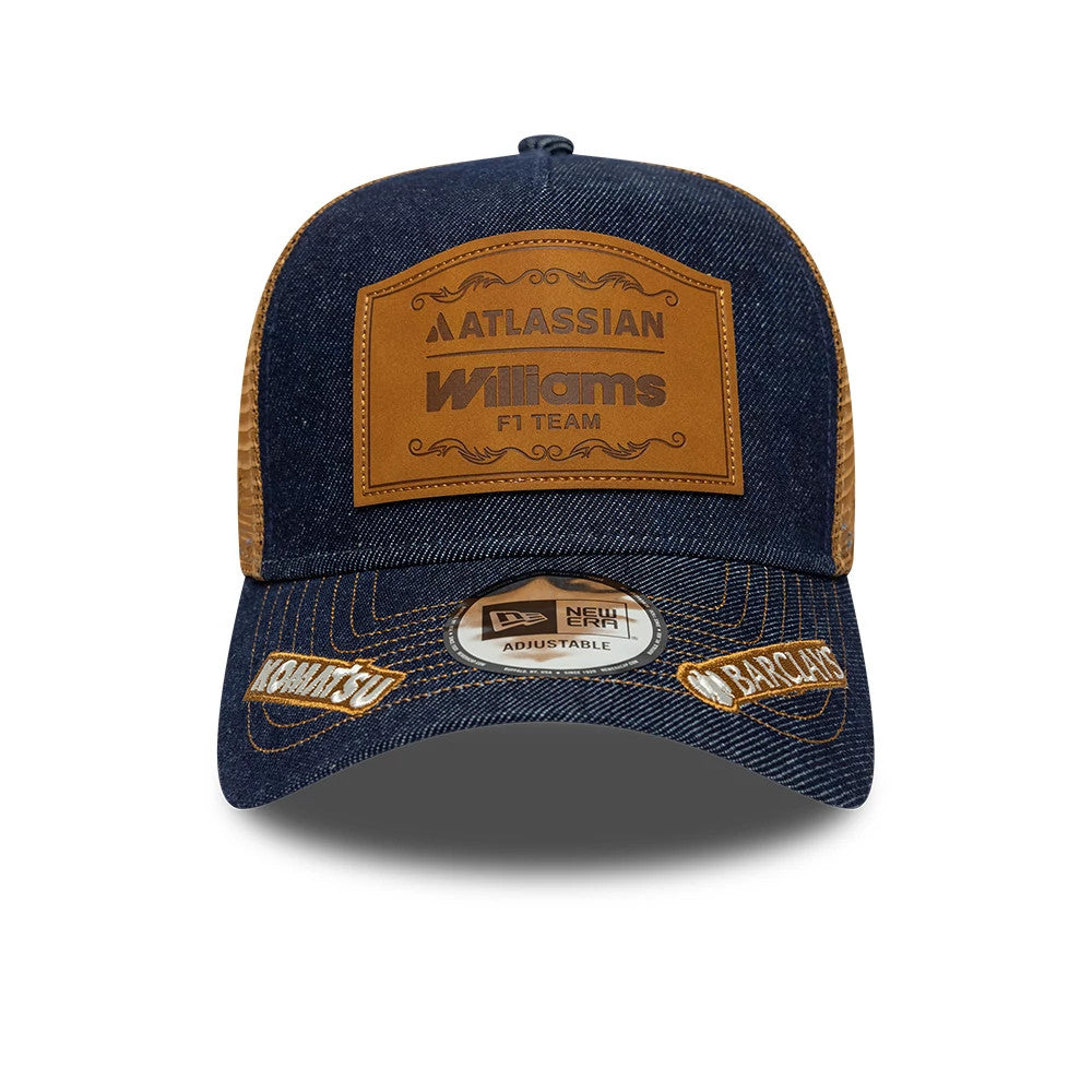 Williams Team Austin Race Special Navy New Era 9FORTY E-Frame Trucker Adjustable Cap, front view showing a brown leather patch with Atlassian Williams F1 Team embossed, gold New Era adjustable sticker, and contrasting brown mesh side panels.