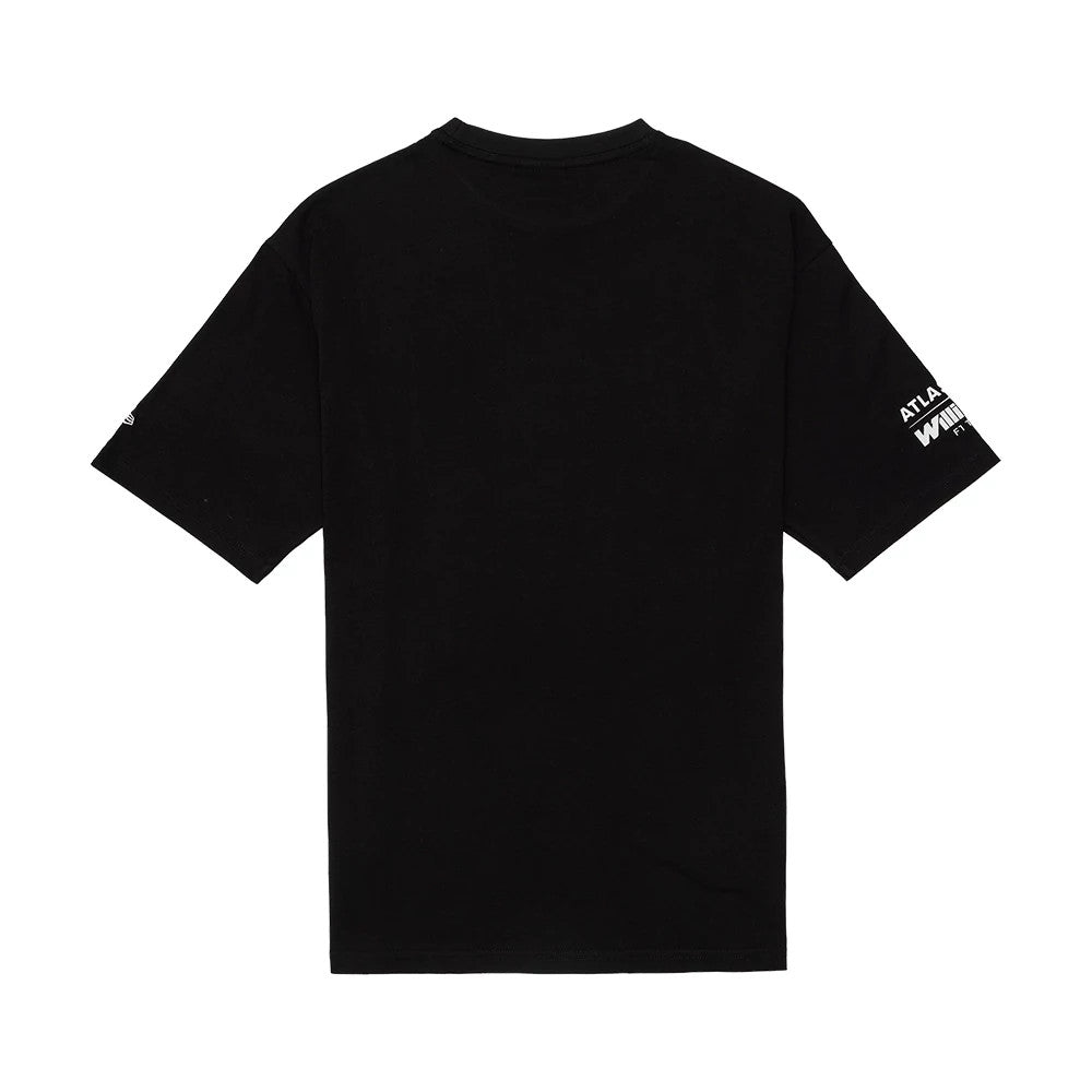 New Era Williams Black Oversized T-Shirt, back view showing the plain black back and short sleeves, with white printed ATLANTA text on the right sleeve and WHITECAPS printed text below it, displaying a casual and relaxed fit.
