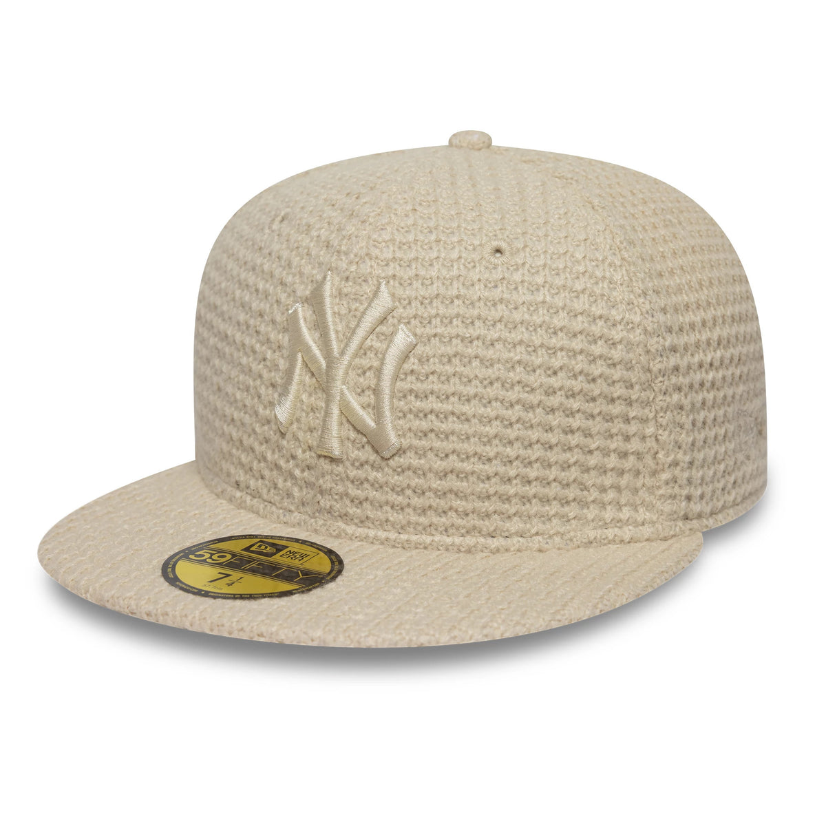 New York Yankees MLB Knitted Light Beige New Era 59FIFTY Fitted Cap, front view showing the raised beige NY logo embroidered on the structured crown, with a flat visor and the gold 59FIFTY size sticker attached.