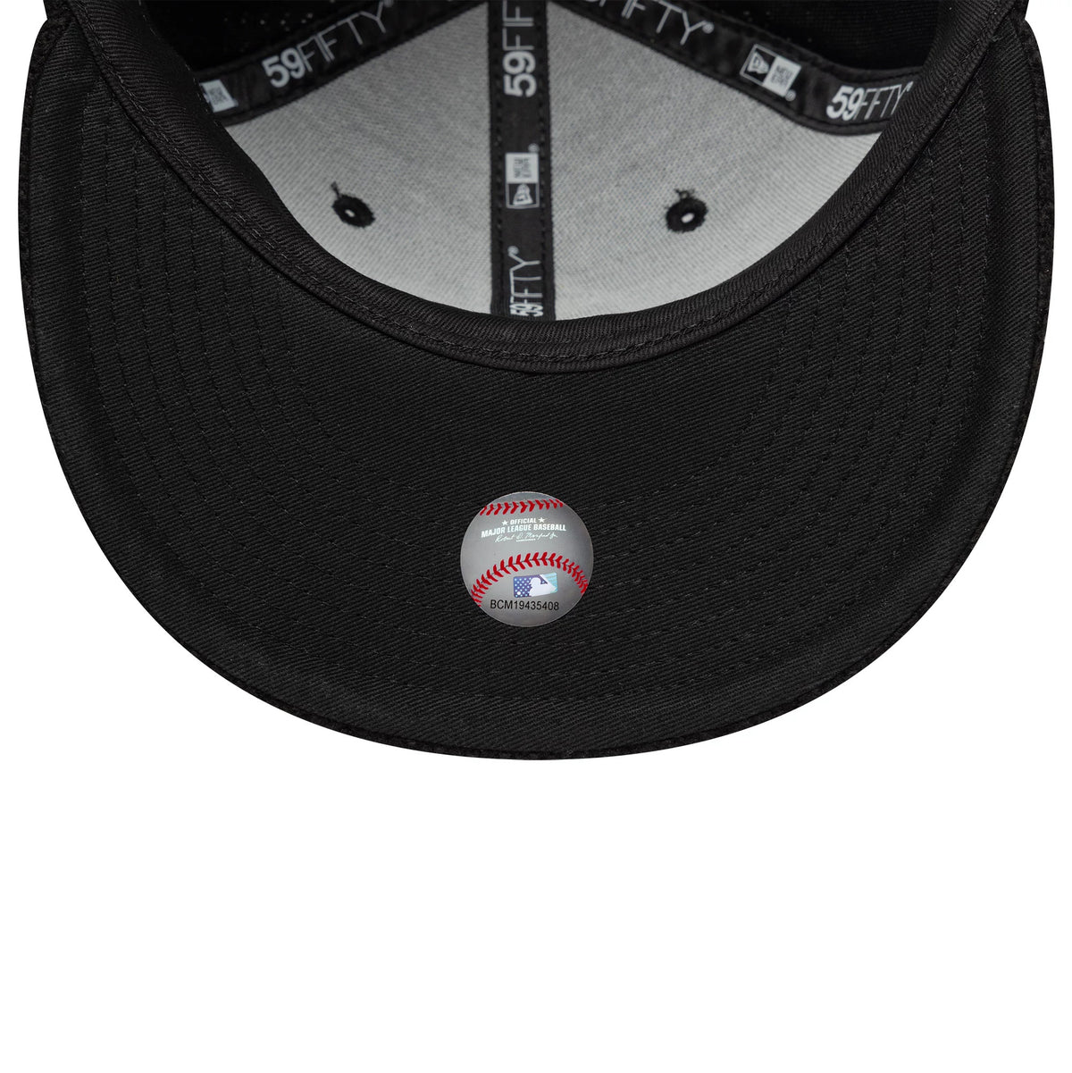 Chicago White Sox MLB Knitted Black New Era 59FIFTY Fitted Cap, inside view showing black 59FIFTY taping along the seams, a white sweatband and a grey undervisor with a baseball-themed sticker featuring red stitching and MLB graphics.