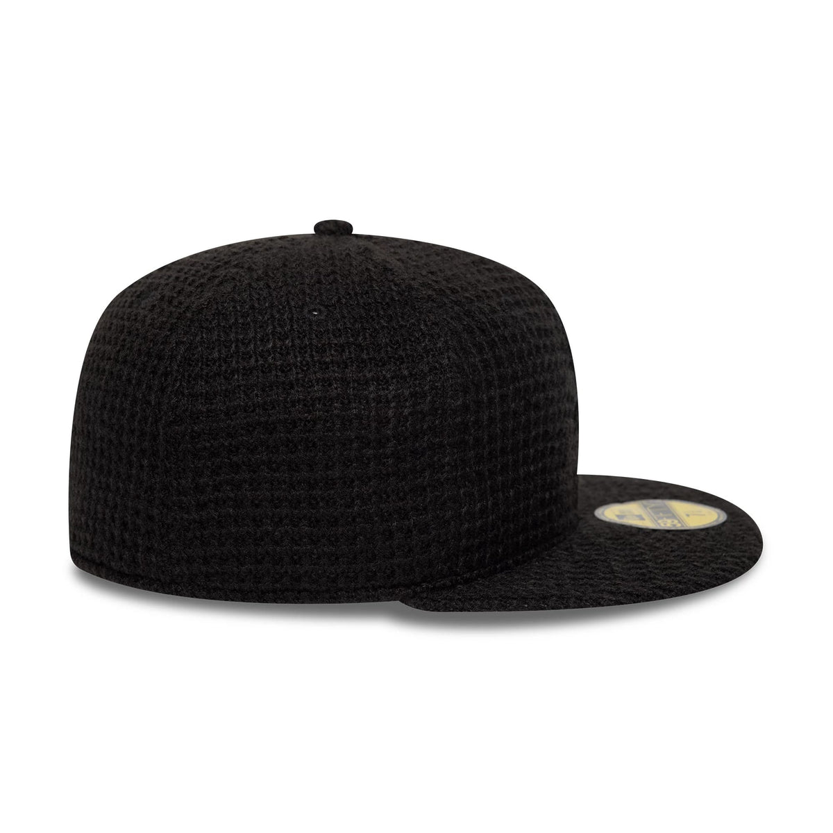 Chicago White Sox MLB Knitted Black New Era 59FIFTY Fitted Cap, side view showing the textured black knitted crown and visor, with the New Era flag logo on the left side and a gold 59FIFTY size sticker on the flat visor.
