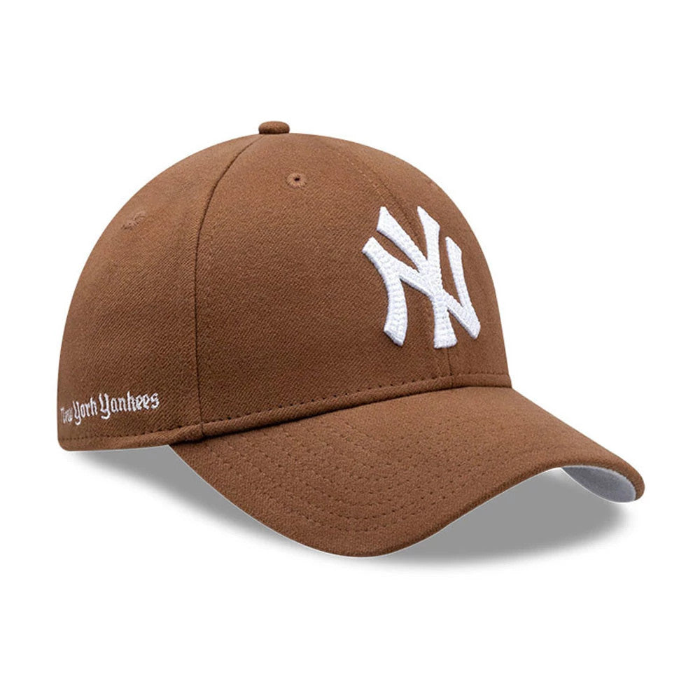 New York Yankees MLB Melton Brown New Era 39THIRTY Stretch Fit Cap, three-quarter view showing a white raised embroidered NY logo on the front panel, brown curved visor with a grey undervisor.
