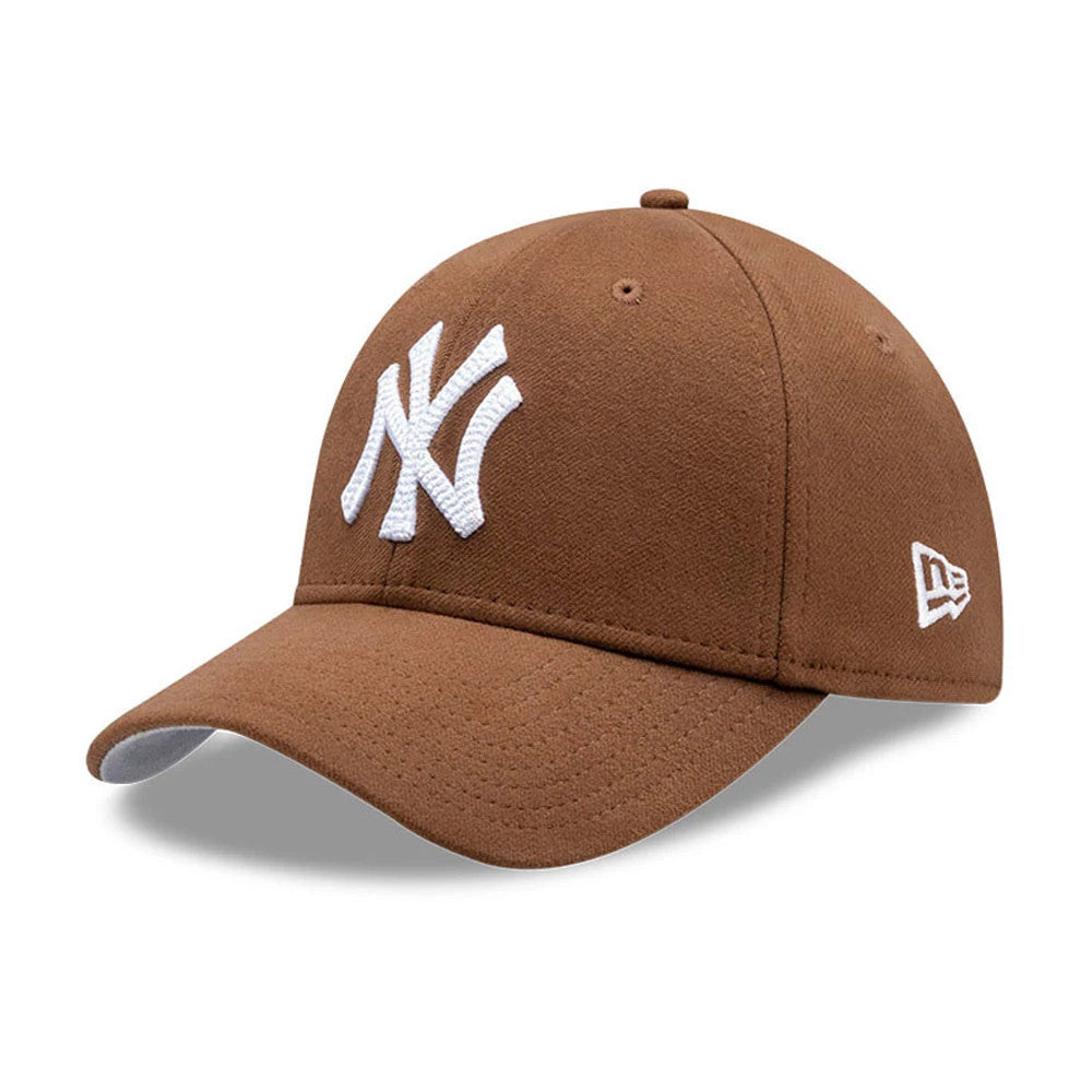 New York Yankees MLB Melton Brown New Era 39THIRTY Stretch Fit Cap, three-quarter view showing the white raised embroidered NY logo on the front panel, a curved brown visor, and the New Era flag logo embroidered in white on the left side.