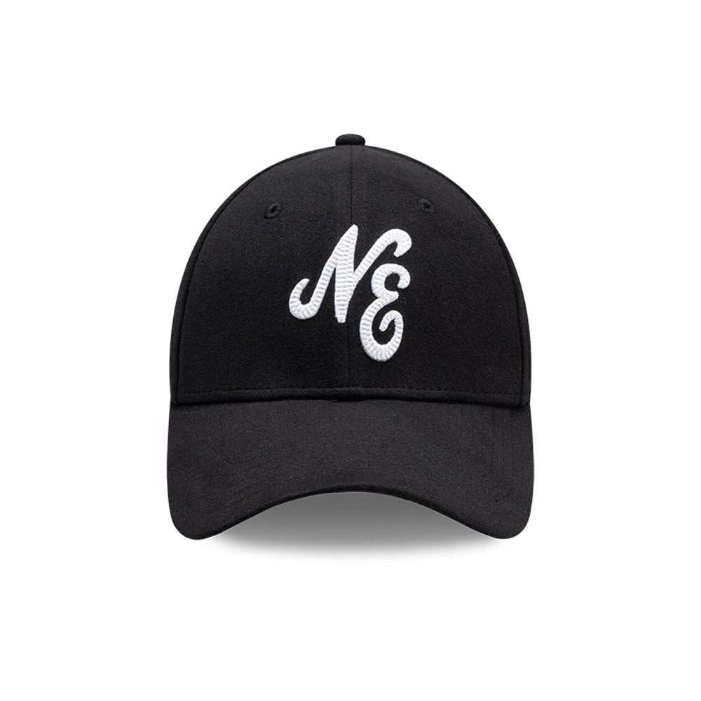 New Era Melton Black New Era 39THIRTY Stretch Fit Cap, front view showing the white embroidered NE logo on the solid black crown, complemented by a curved black visor and small black eyelets for added detail.
