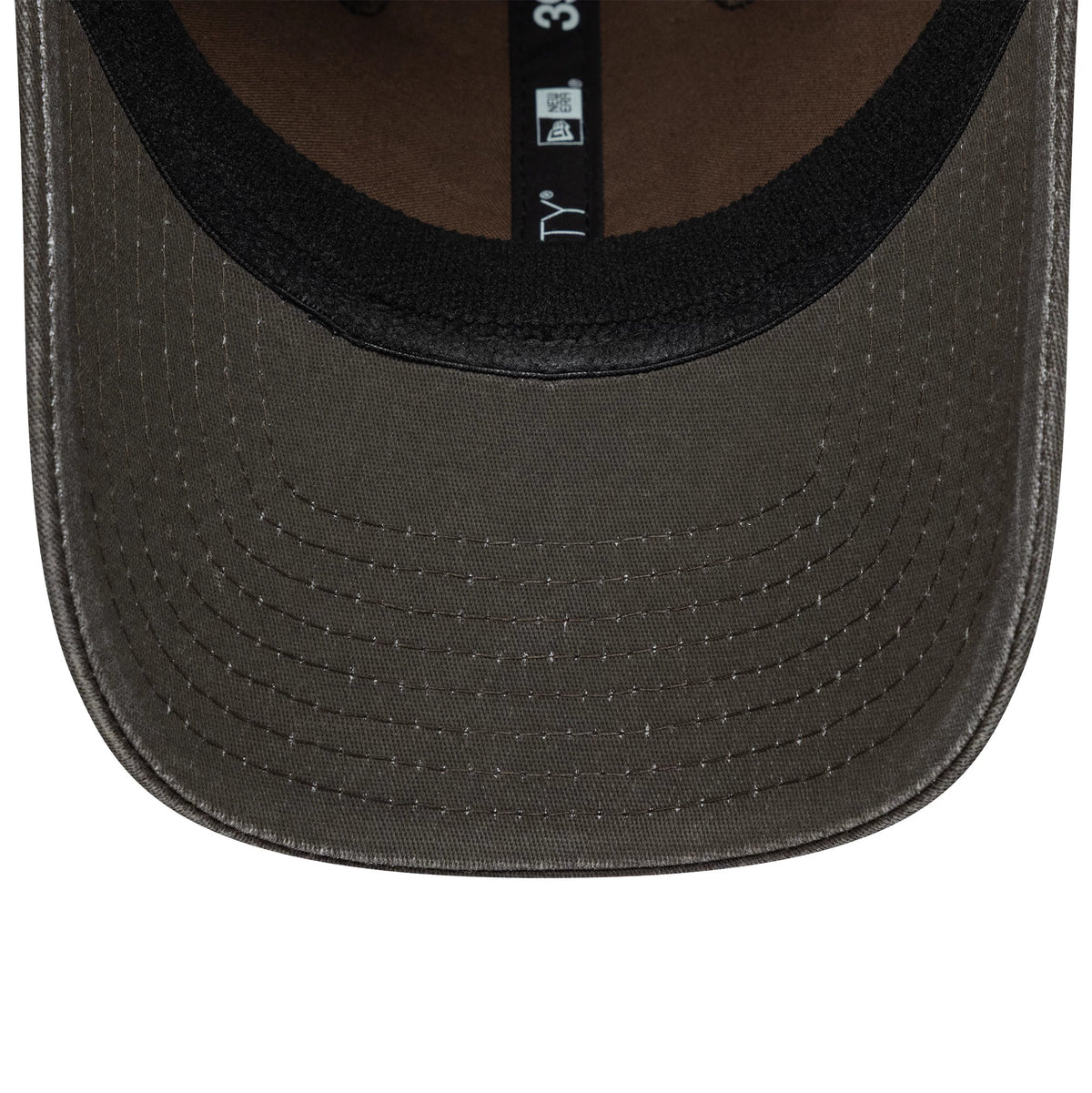 New Era Ombre Dark Brown 39THIRTY Stretch Fit Cap, inside view showing the black sweatband, dark brown undervisor with neat stitching, and New Era 39THIRTY branding on the internal taping.