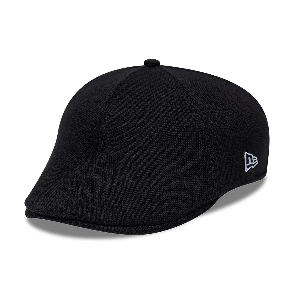 New Era New York Yankees MLB Knitted Black Duckbill Cap, three-quarter view showing the textured black knitted fabric with a finish, a curved duckbill visor, and the embroidered white New Era flag logo on the left side.
